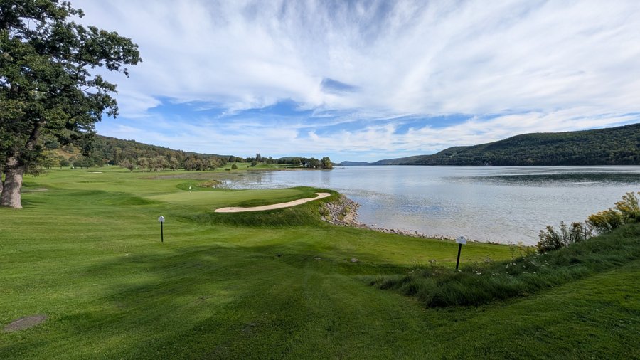 Lakeside lawn and distant hills