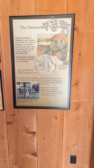 Museum interpretation panel on a wooden wall