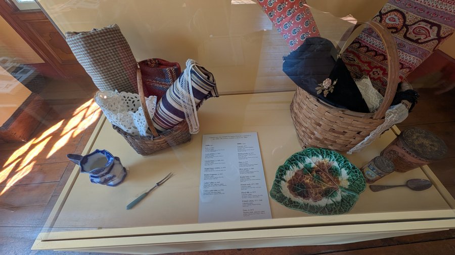 Household tools and textiles on a display table