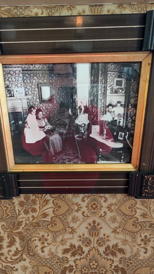 Historic room exhibit behind glass