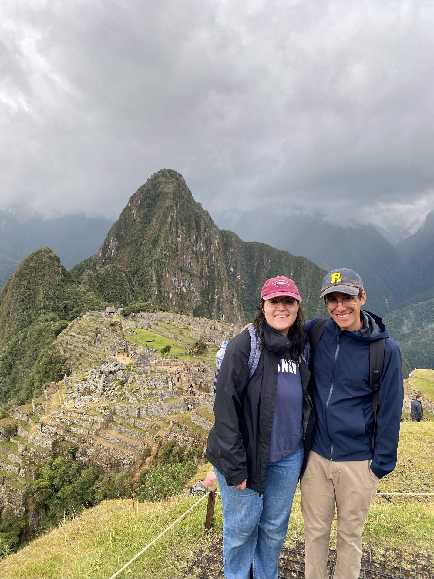 A person and person standing on a mountain AI-generated content may be incorrect.