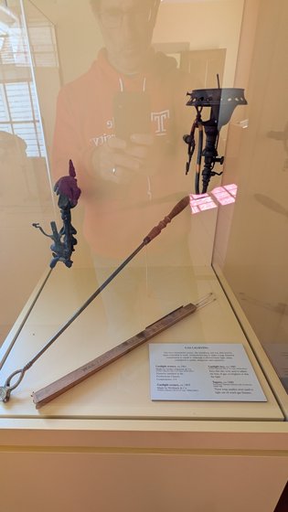 Historical lighting tools in a display case